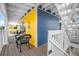 Inviting balcony with cozy seating and bright colored walls, perfect for relaxation and outdoor enjoyment at 6531 Turtlemound Rd, New Smyrna Beach, FL 32169