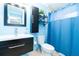Cozy bathroom with modern vanity, a stylish mirror, and a shower-tub combination at 6531 Turtlemound Rd, New Smyrna Beach, FL 32169