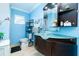 Bathroom featuring unique sink, wooden vanity, and modern fixtures at 6531 Turtlemound Rd, New Smyrna Beach, FL 32169