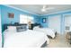 Bright bedroom featuring two queen beds, ceiling fan, and closet at 6531 Turtlemound Rd, New Smyrna Beach, FL 32169