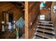 Charming entryway with wood paneling, tiled steps, and nautical decorations creates a coastal welcome at 6531 Turtlemound Rd, New Smyrna Beach, FL 32169