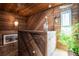 Rustic wood staircase with nautical decor, creating a unique and charming entryway at 6531 Turtlemound Rd, New Smyrna Beach, FL 32169