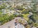 Aerial view of a residential neighborhood showcasing mature trees and a serene lake at 701 Kristina Ct, Port Orange, FL 32127