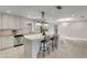 Well-equipped kitchen featuring stainless steel appliances, a breakfast bar, and granite countertops at 701 Kristina Ct, Port Orange, FL 32127