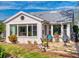 Inviting back patio with a stone floor, comfortable seating, an outdoor grill, and lush tropical surroundings at 751 Pine Shores Cir, New Smyrna Beach, FL 32168