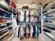 Organized walk-in closet with ample shelving and hanging space for clothes, shoes, and accessories at 751 Pine Shores Cir, New Smyrna Beach, FL 32168