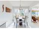 Cozy dining area with comfortable seating, natural light, and views of the garden at 751 Pine Shores Cir, New Smyrna Beach, FL 32168