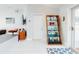Welcoming entryway with a view into the living area and a decorative shelving unit at 751 Pine Shores Cir, New Smyrna Beach, FL 32168