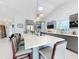 Open kitchen featuring a large island, modern appliances, and a bright, airy design perfect for entertaining at 751 Pine Shores Cir, New Smyrna Beach, FL 32168