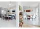 A bright kitchen with a large island and adjacent formal dining room showcasing an open-concept design at 751 Pine Shores Cir, New Smyrna Beach, FL 32168