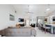 Open concept living space featuring kitchen with island seating and spacious living room area with skylight at 751 Pine Shores Cir, New Smyrna Beach, FL 32168