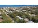 Aerial view of property near the ocean showcasing the surrounding neighborhood and lush greenery at 817 E 20Th Ave, New Smyrna Beach, FL 32169