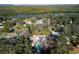 Aerial view of the property showcasing lush surroundings and waterfront proximity at 820 Faulkner St, New Smyrna Beach, FL 32168