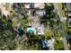 Aerial view of the property and pool highlighting the layout and surrounding landscape at 820 Faulkner St, New Smyrna Beach, FL 32168