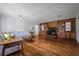 Inviting living room with hardwood floors, fireplace and custom built-ins at 820 Faulkner St, New Smyrna Beach, FL 32168