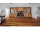 Living room featuring hardwood floors, fireplace and custom built-ins at 820 Faulkner St, New Smyrna Beach, FL 32168