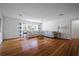 Bright living room with hardwood floors, oversized windows, and comfortable seating at 820 Faulkner St, New Smyrna Beach, FL 32168