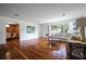 Spacious living room features gleaming hardwood floors and abundant natural light at 820 Faulkner St, New Smyrna Beach, FL 32168