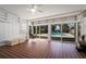 Sun room featuring a swing chair, large windows overlooking a pool, and tiled flooring at 820 Faulkner St, New Smyrna Beach, FL 32168