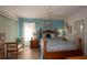Comfortable bedroom features wood furniture, light blue walls, and bright natural light at 848 Pine Shores Cir, New Smyrna Beach, FL 32168