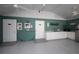 The clubhouse features a kitchenette area with white cabinets and modern appliances at 848 Pine Shores Cir, New Smyrna Beach, FL 32168