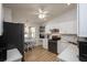 Updated kitchen with white cabinets, stainless steel appliances, and adjacent dining area at 848 Pine Shores Cir, New Smyrna Beach, FL 32168