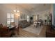 Bright living room with vaulted ceilings, wood floors, and neutral colors at 848 Pine Shores Cir, New Smyrna Beach, FL 32168