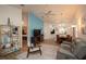 Inviting living space featuring wood floors, modern decor, and a view into a cozy bedroom at 848 Pine Shores Cir, New Smyrna Beach, FL 32168