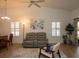 Bright living room with vaulted ceilings, neutral colors, and comfortable seating at 848 Pine Shores Cir, New Smyrna Beach, FL 32168