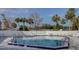 Large community swimming pool with plenty of seating and lounging space at 848 Pine Shores Cir, New Smyrna Beach, FL 32168