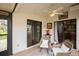 Inviting sunroom featuring wicker chairs, tile flooring, and sliding glass doors at 848 Pine Shores Cir, New Smyrna Beach, FL 32168