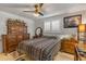 Bedroom with a wooden dresser, a mirror, and a window with white shutters at 921 Duncan Rd, South Daytona, FL 32119