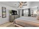 Comfortable bedroom featuring a ceiling fan, window shutters, and stylish decor at 921 Duncan Rd, South Daytona, FL 32119