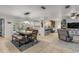 Dining area with modern lighting, opening to the living area and views of the pool at 921 Duncan Rd, South Daytona, FL 32119