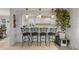 Bright kitchen featuring a breakfast bar with seating and pendant lighting at 921 Duncan Rd, South Daytona, FL 32119