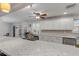 Updated kitchen with stainless steel appliances, white cabinets, granite countertops, and recessed lighting at 921 Duncan Rd, South Daytona, FL 32119