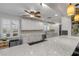 Updated kitchen with stainless steel appliances, white cabinets, granite countertops, and recessed lighting at 921 Duncan Rd, South Daytona, FL 32119