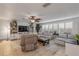 Spacious living area featuring tile floors, a ceiling fan, and large windows for natural light at 921 Duncan Rd, South Daytona, FL 32119