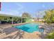 Inviting pool with a brick surround, seamlessly connected to a covered outdoor patio at 921 Duncan Rd, South Daytona, FL 32119