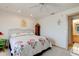 Bright bedroom with a ceiling fan and floral accents at 921 N Atlantic Ave, New Smyrna Beach, FL 32169