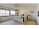 Comfortable bedroom featuring beach views from the windows and carpeted floors at 921 N Atlantic Ave, New Smyrna Beach, FL 32169