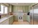 Charming kitchen featuring unique cabinets, modern appliances, and ample counter space at 921 N Atlantic Ave, New Smyrna Beach, FL 32169