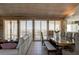 Open concept living area featuring ocean view, wood ceiling, and dining table at 921 N Atlantic Ave, New Smyrna Beach, FL 32169