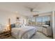 Bright main bedroom featuring coastal decor and stunning ocean views from the large windows at 921 N Atlantic Ave, New Smyrna Beach, FL 32169