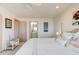 Serene main bedroom with ensuite bathroom, nautical accents, and bright natural light at 921 N Atlantic Ave, New Smyrna Beach, FL 32169