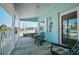 Relax on this balcony furnished with several places to sit and enjoy yourself at 923 Locust St, New Smyrna Beach, FL 32169