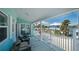 This balcony boasts views of the neighborhood with relaxing patio seating at 923 Locust St, New Smyrna Beach, FL 32169
