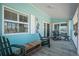 The balcony provides shade and comfortable seating to enjoy the beautiful weather at 923 Locust St, New Smyrna Beach, FL 32169