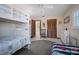 bedroom with bunkbeds, twin bed and nautical theme, and wood closet doors at 923 Locust St, New Smyrna Beach, FL 32169