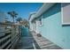 Inviting side deck with weathered wood and comfortable seating at 923 Locust St, New Smyrna Beach, FL 32169